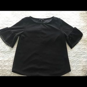 Black blouse with eyelet style detail